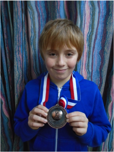 Oliver bronze karate medal